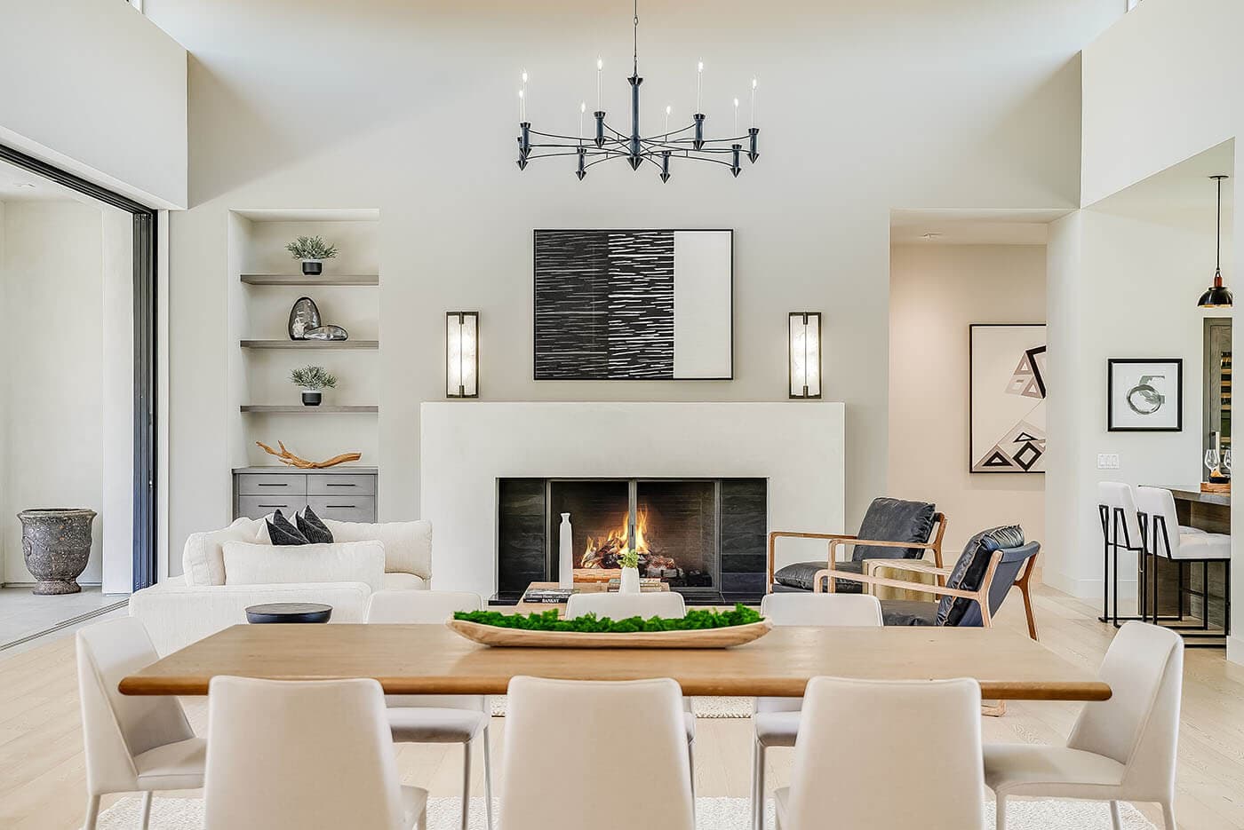A bright dining room with a fireplace, photographed by a member studio